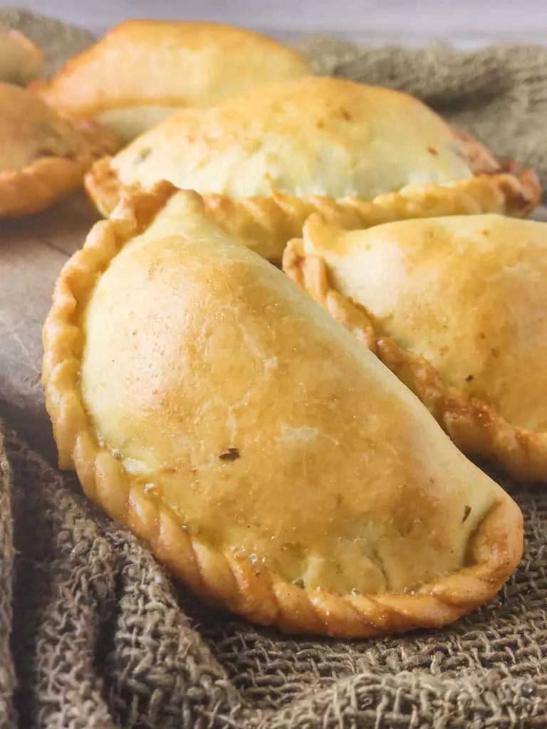 image of baked empanadillas with chicken and cheese