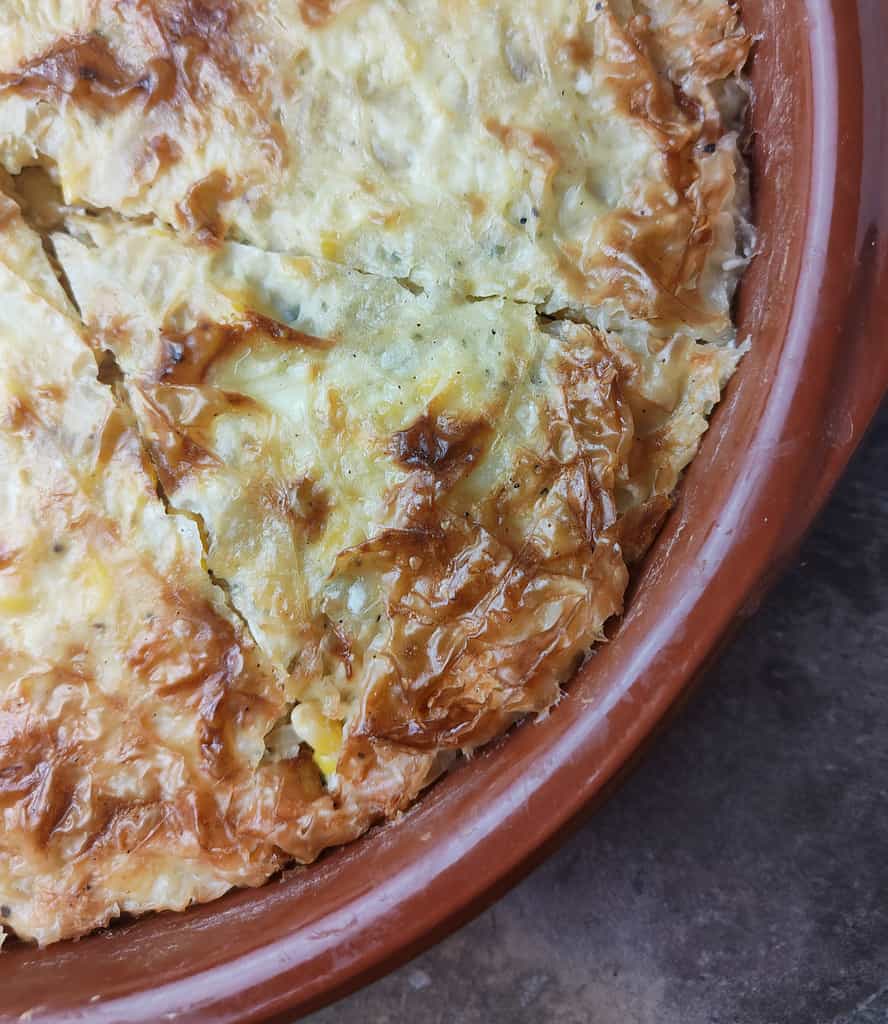 image showing how to slice a hot baked phyllo cabbage pie 