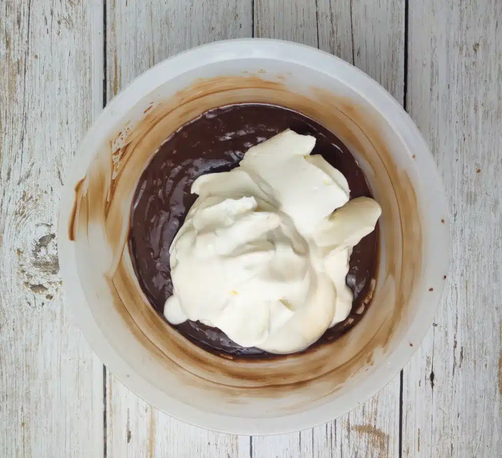 Preparing chocolate layer for blueberry chocolate cake. 