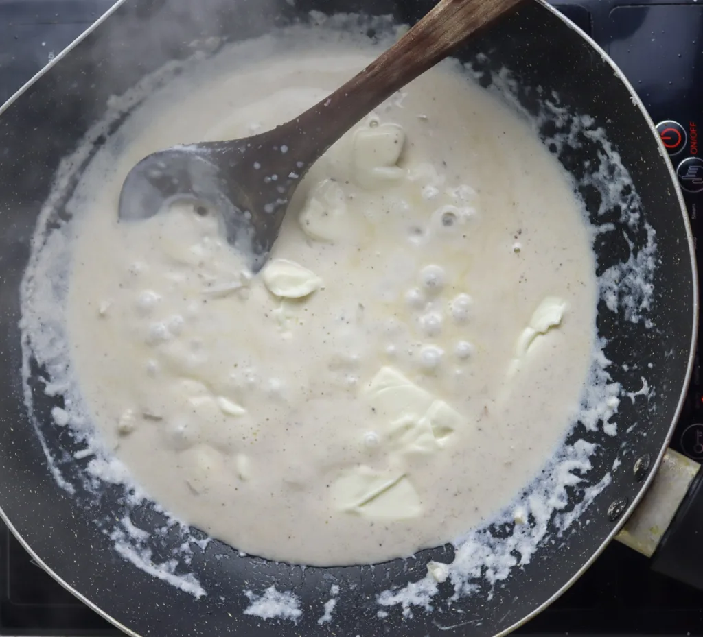 adding cheese singles to the sauce 