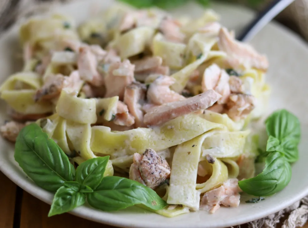 beautiful photo of pasta with salmon and white sauce