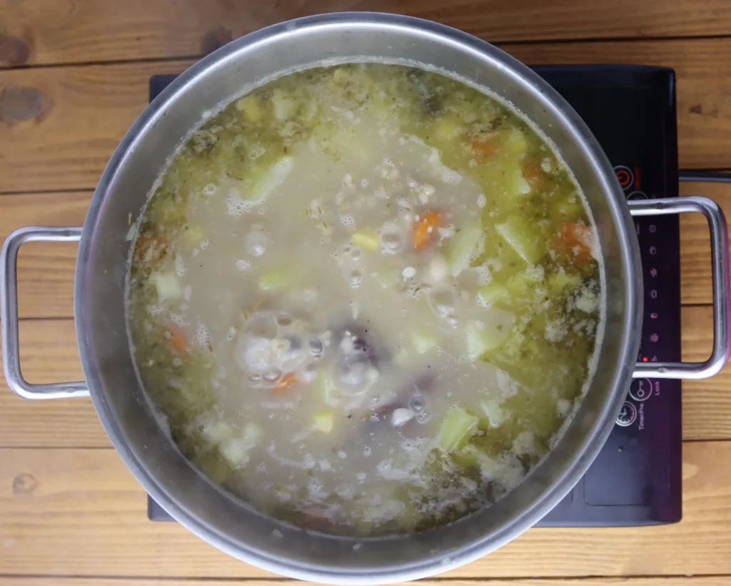 step seven: adding potatoes to to the simmering soup, simmer for another 20 minutes