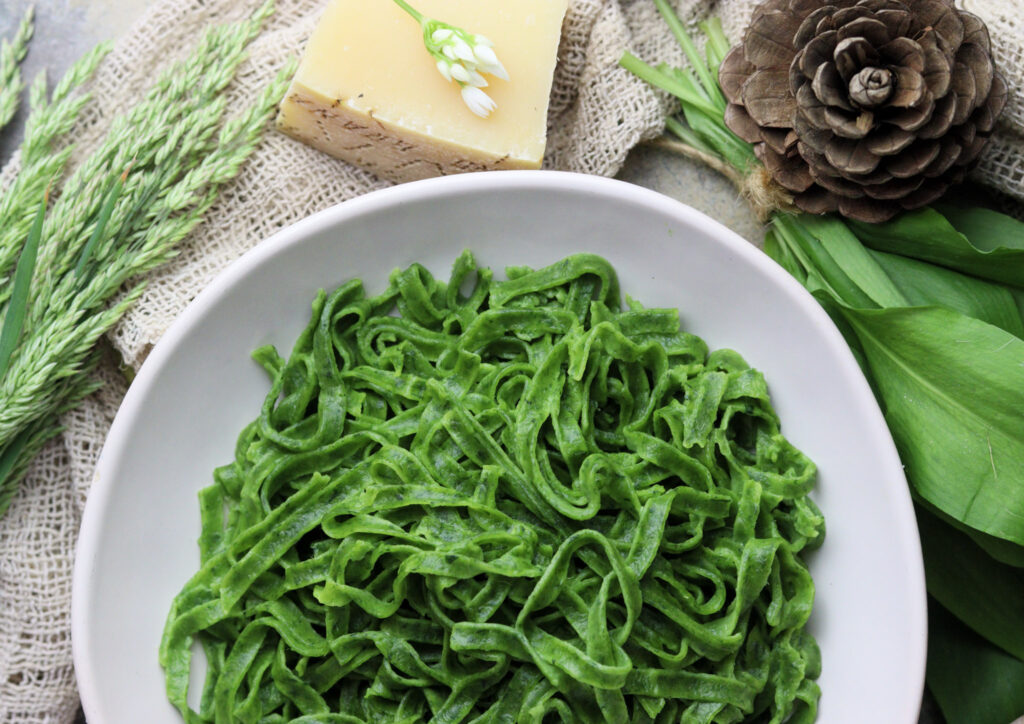 beautiful serving of homemade fresh green pasta 