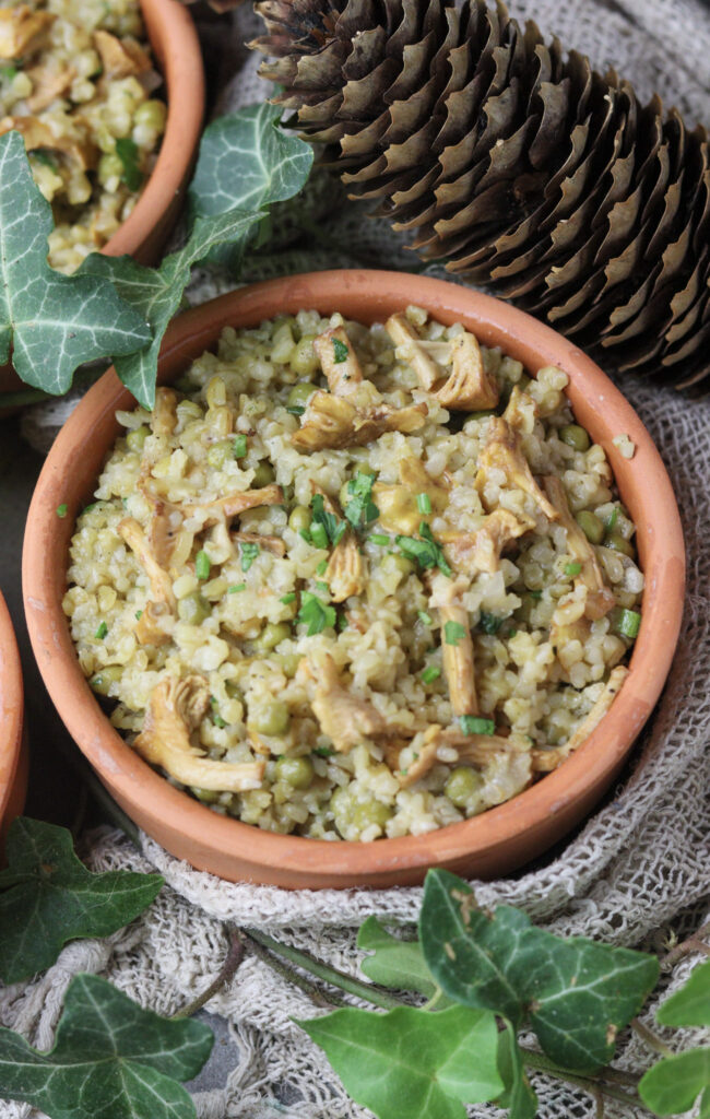 A bowl of delicious bulgur risotto with chanterelle mushrooms